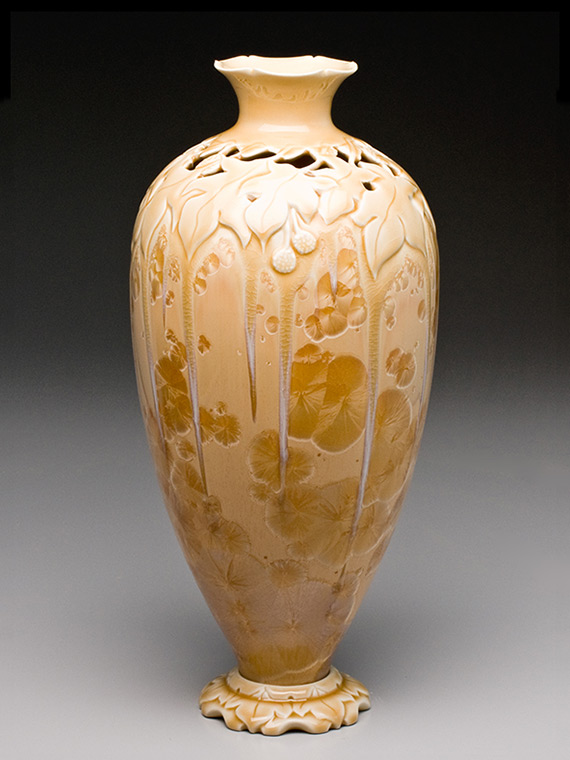 tall peach carved crystalline glazed vase on carved pedestal