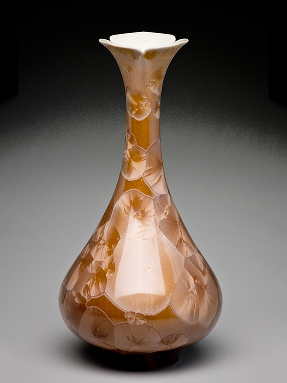 rust colored crystalline glazed vase with long narrow neck
