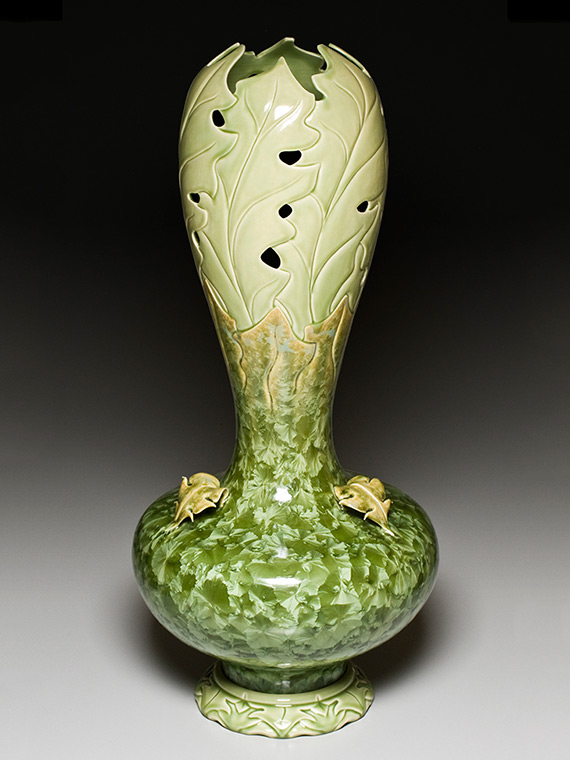 very large moss green carved crystalline glazed vase on carved pedestal